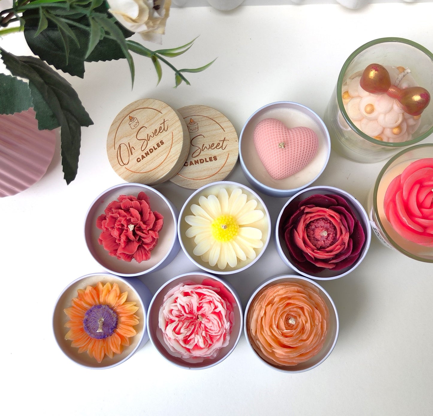 A Collection of iconic scented candles from Oh Sweet Candles with wonderfully cute floral decoration and divine scents perfect for any time of the year.